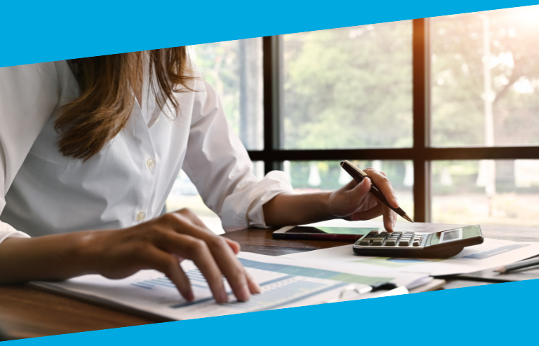 Woman using calculator
